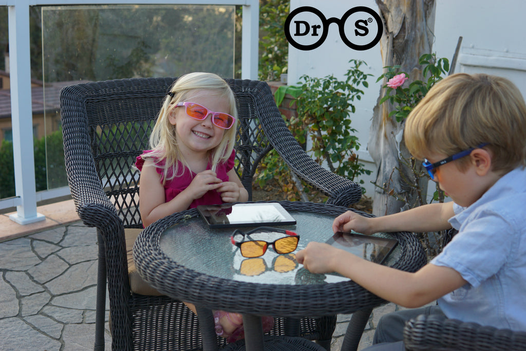 kids using blue light blocking glasses outside